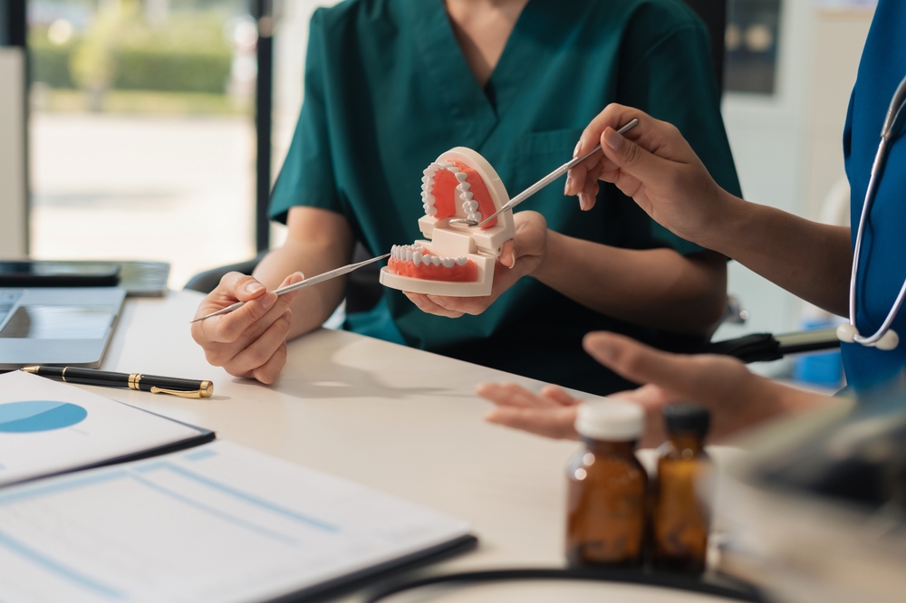 Dental team reviewing patient treatment plans